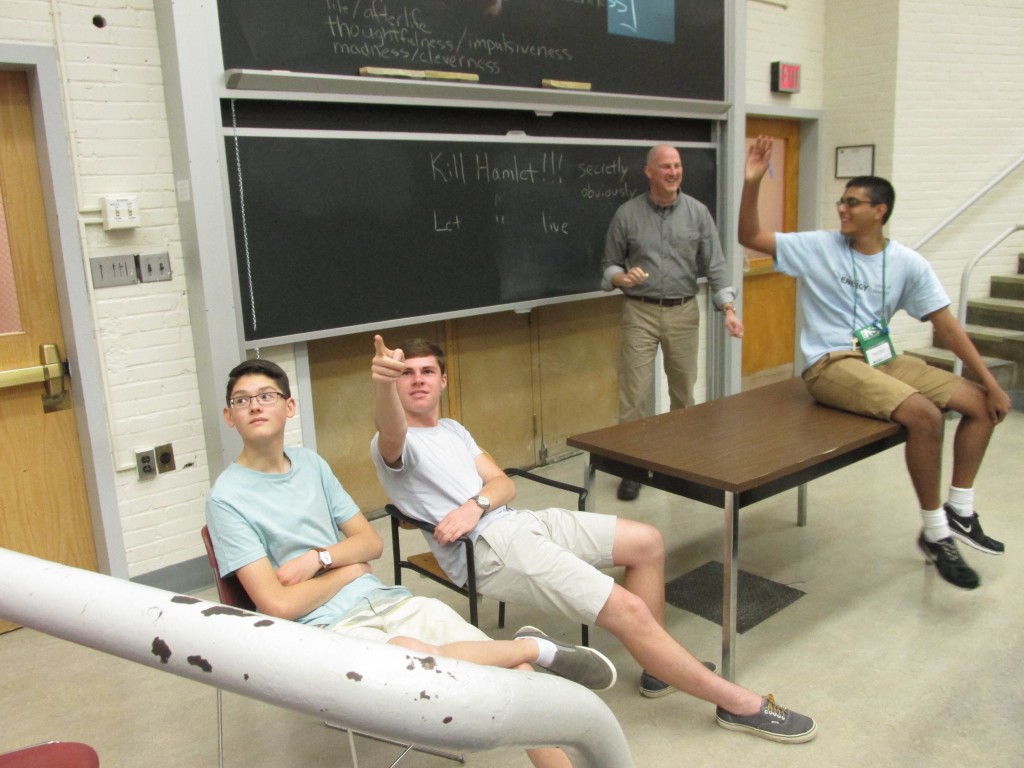 One of many interactive class discussions. John Chapman (center) as King Claudius, Jonothan Chow (left) as his hand picked Minister of the Treasury and Abi Krishnan (right) as the unfortunate Hamlet pleading for mercy.