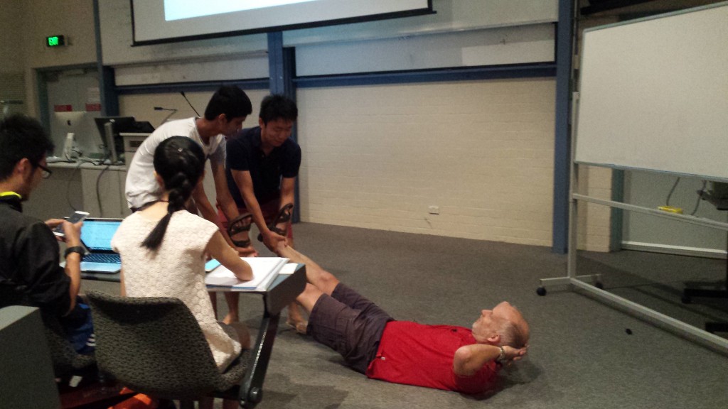 Our Physics lecturer, Paul Francis, demonstrating friction with the help of some students.